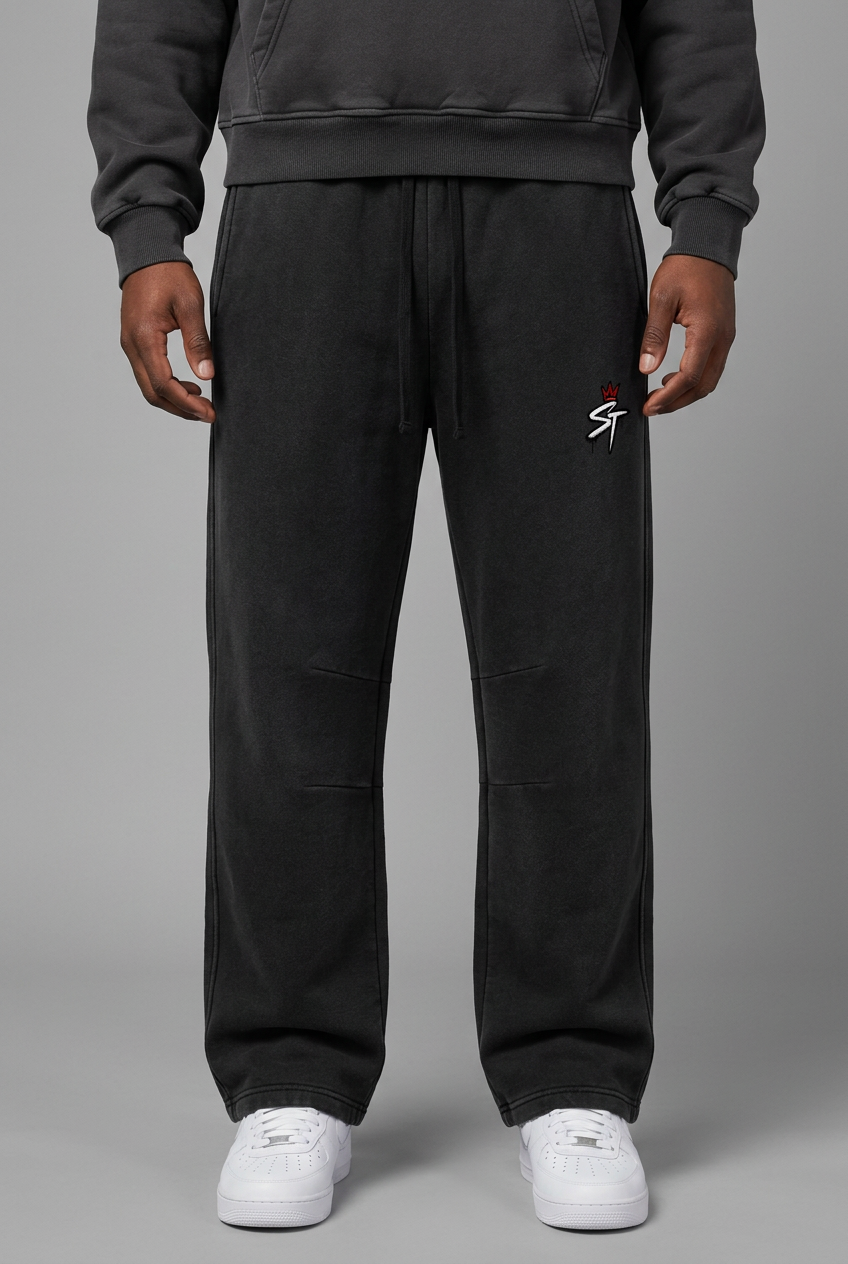 Front close-up of Foundation Vintage Black pants on model wearing matching Concrete hoodie