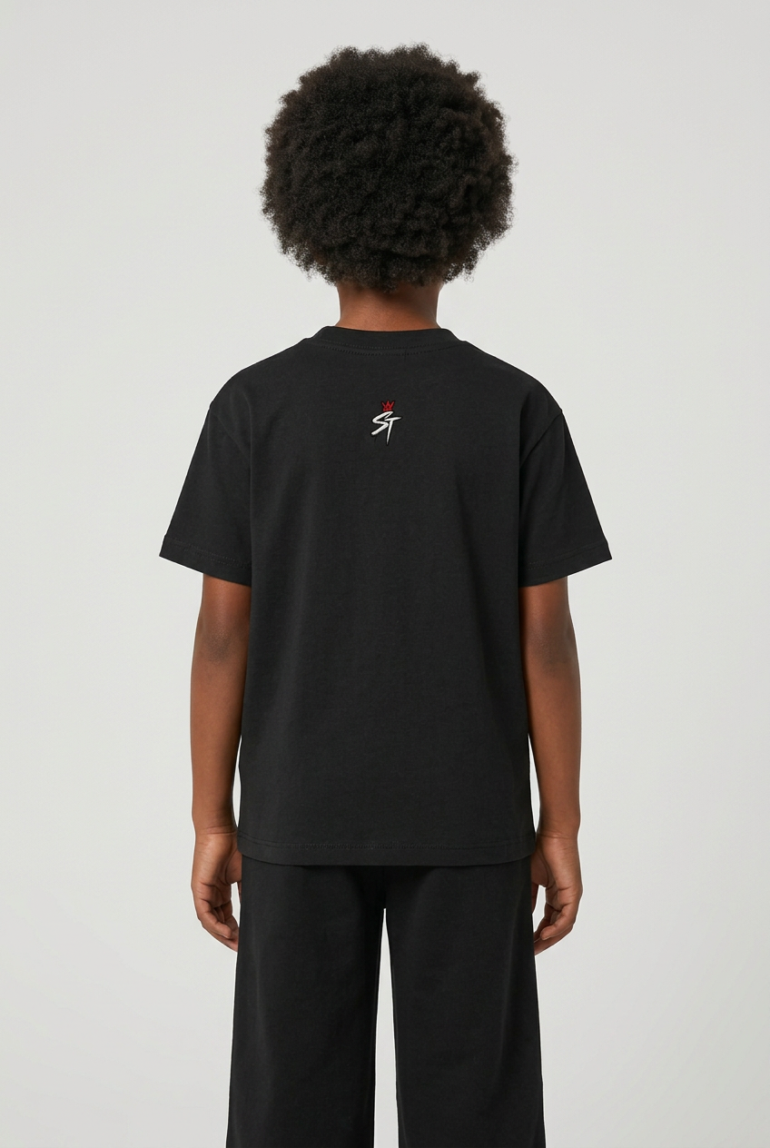 Back view of child wearing Next Up Jet Black tee with original small crowned ST neck logo