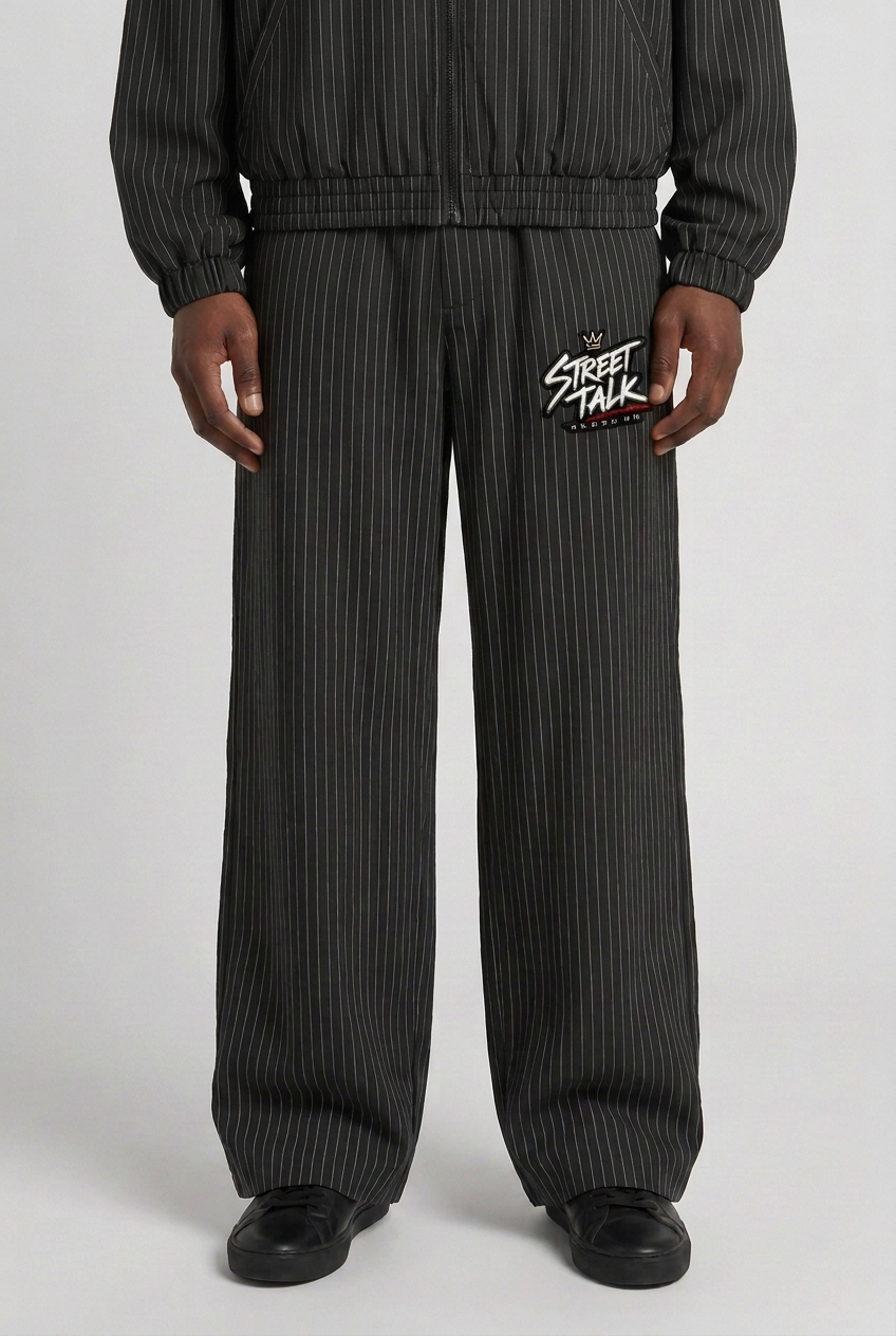 Front close-up of loose wide-leg Uptown Midnight Black trousers with matching jacket worn